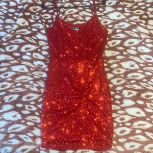 Red sequence dress that is very comfortable and fitted. With adjustable straps